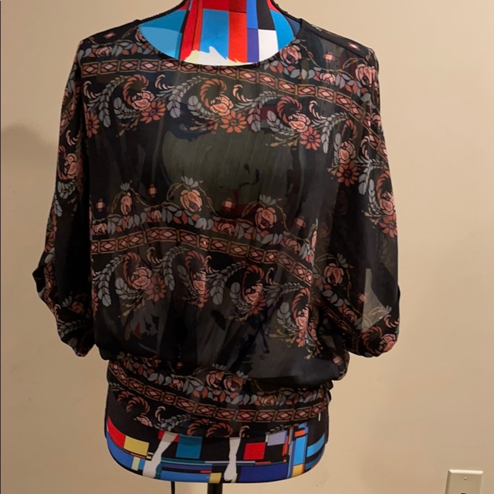 Woman’s silky flowered shirt
